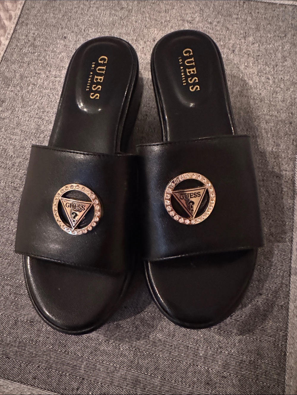 GUESS Black Slide Mules with Gold Logo Medallions